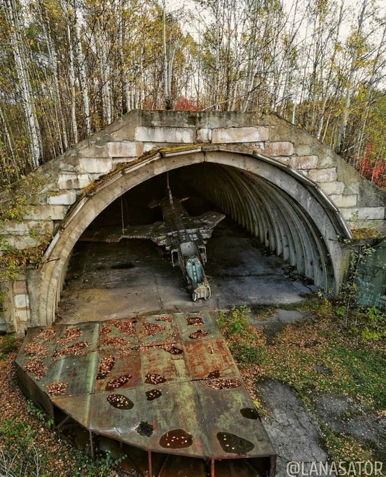 28. Rusting Mig-23 Soviet combat aircraft in its shelter, near Komsomolsk-on-Amur